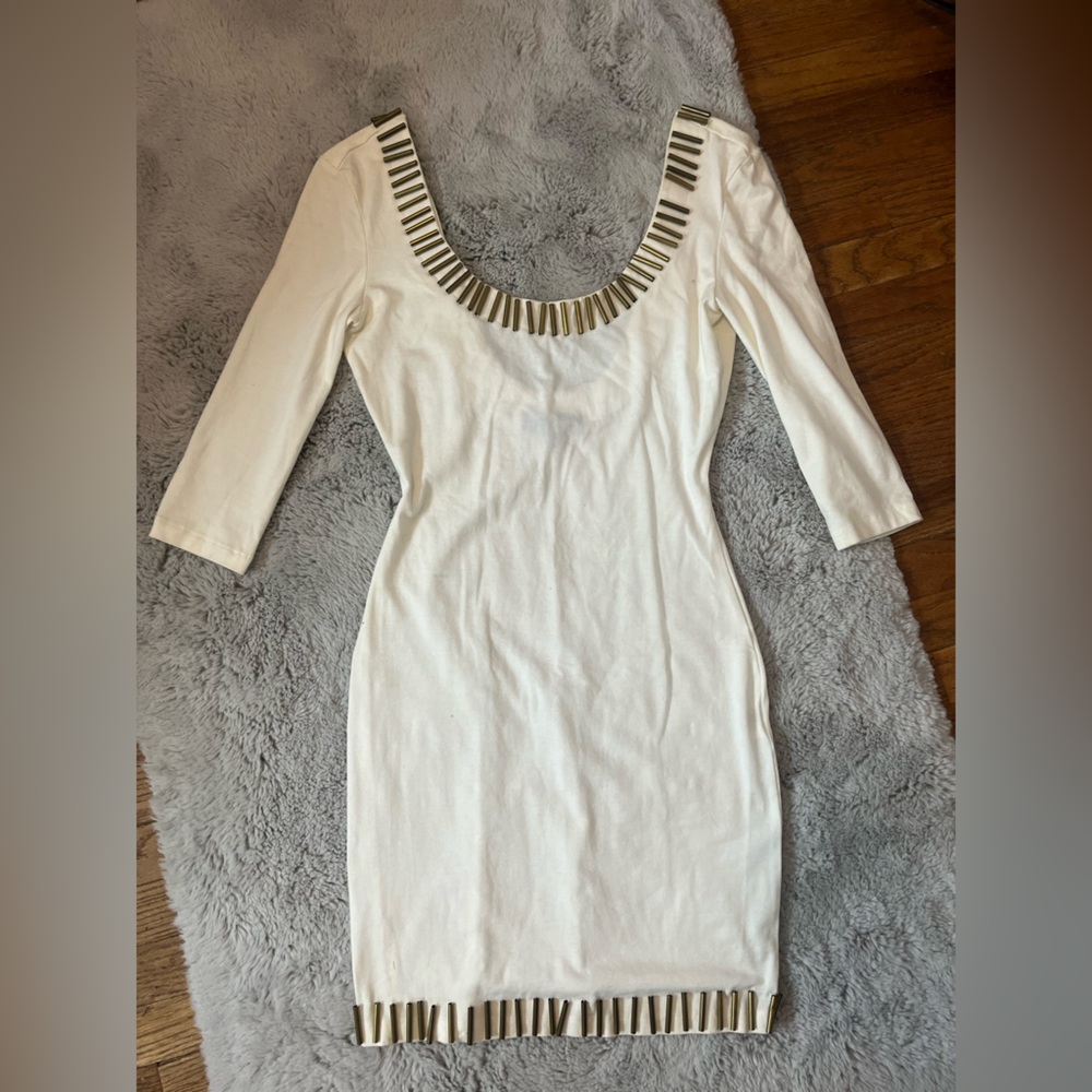 White dress with gold metal accents